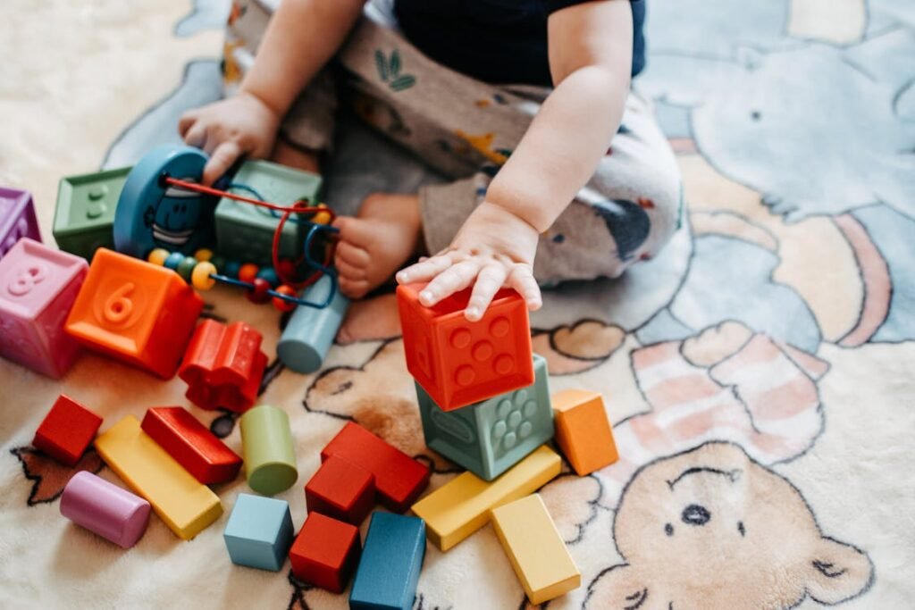 Child playing with colorful building blocks